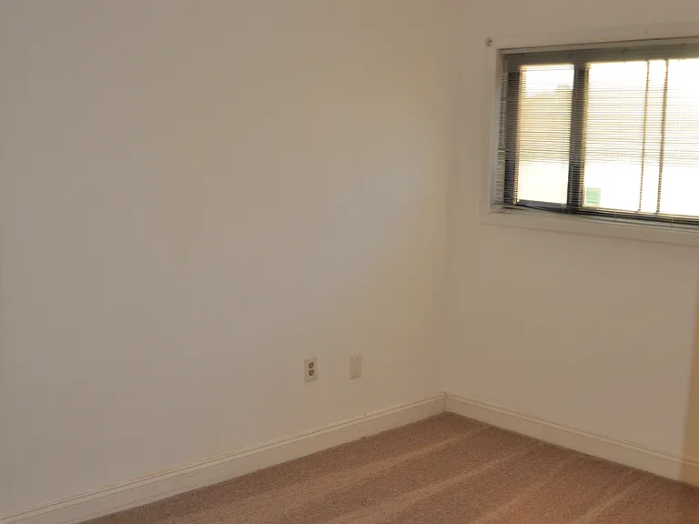Second bedroom with large closet and ceiling fan