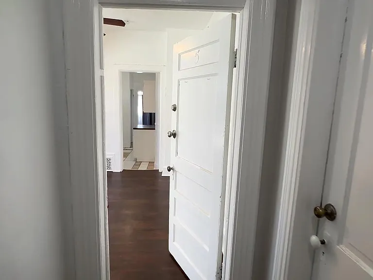 Upstairs shared hall, Opened is entry door to the 1 bedroom suite, to the right second apartment entry.