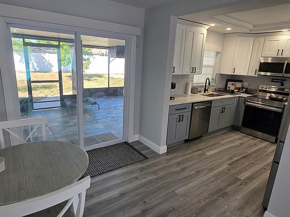 Dining area/Kitchen/View of Patio