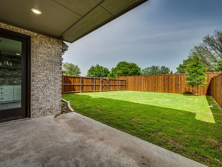 This door leads you back to the kitchen. This lawn care will be part of your rent which allow you to enjoy more time enjoying the community pool, sunny deck, pavilion and fireplace