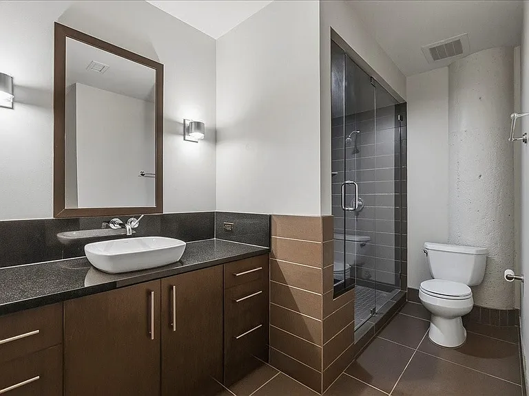 Hallway access so guests do not have to enter bedroom to get to bath.