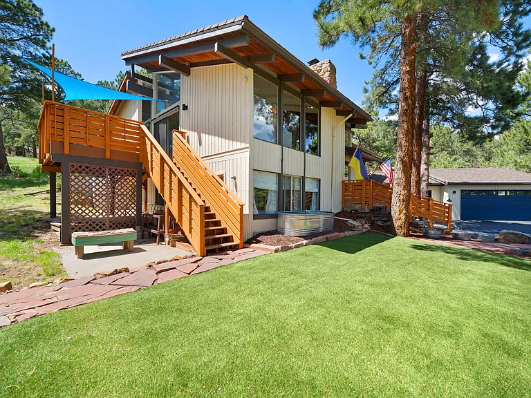 outdoor area includes small turf field for playing or relaxing.