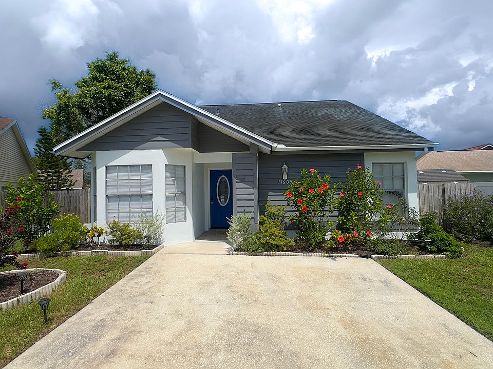 Cottage with pretty flowers make this the place you will want to come home to everyday.