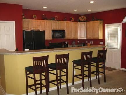 Kitchen : Dining room area looking into kitchen over bar.