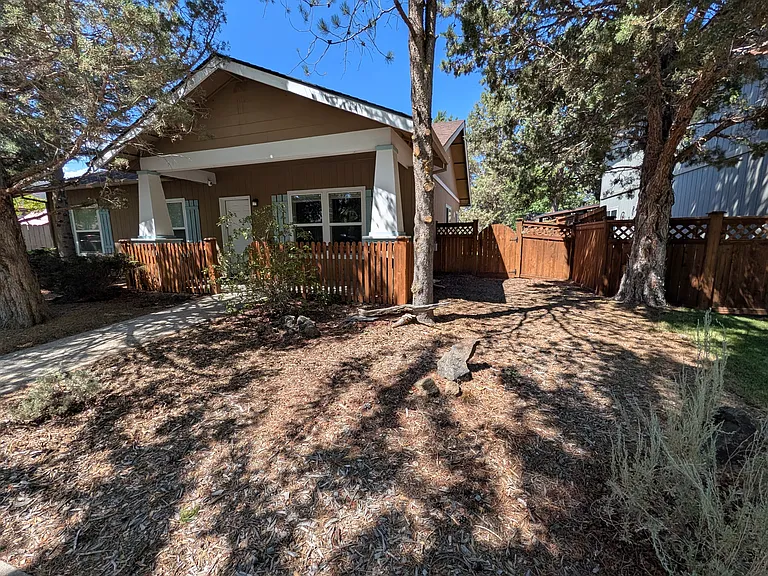 Shady front of the house on a tree-lined quiet street
