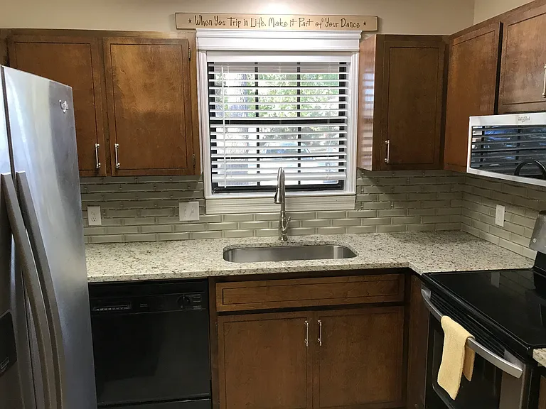 view of the window and the refrigerator.