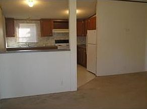 Interior of home looking from the living area to the kitchen.