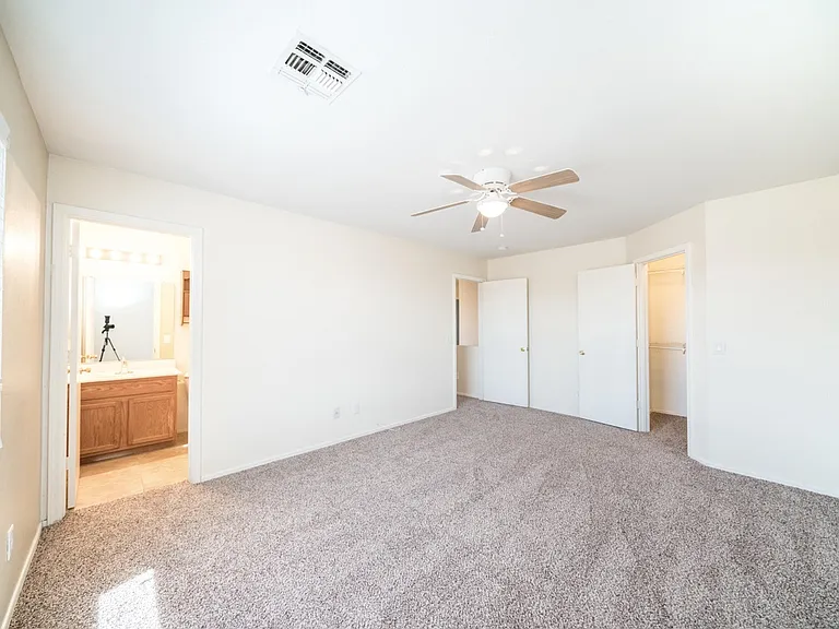 Primary bedroom and bathroom