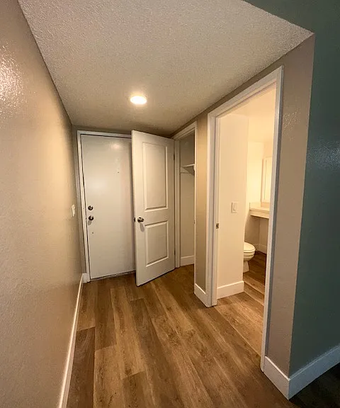 Front door, hallway closet and half bathroom