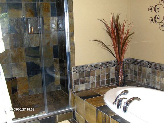 5 Piece master bath with generous use of slate tile.