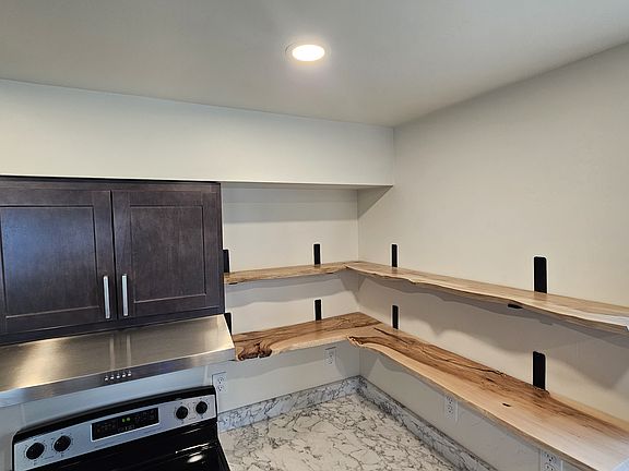Raw Maple shelves repurposed from the Maple trees that stood on the property