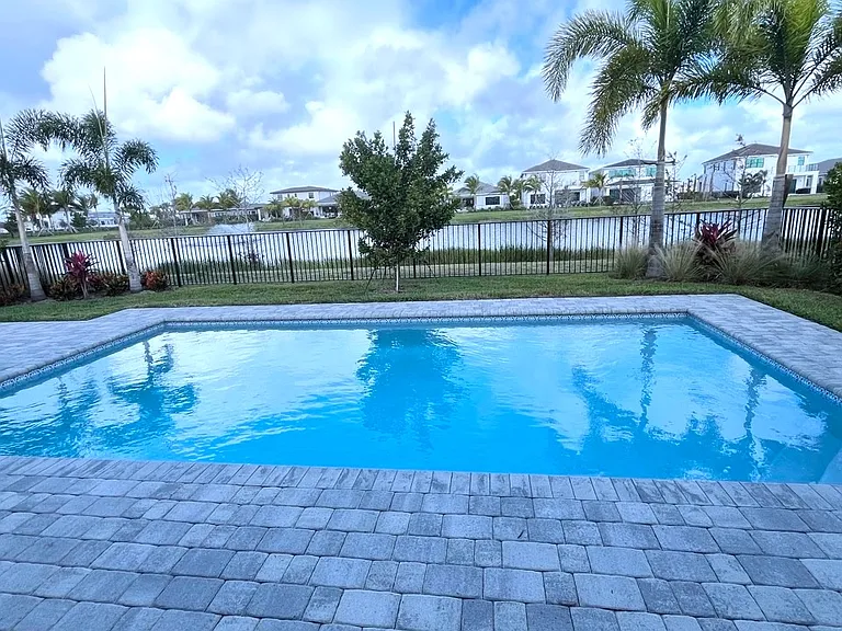 in-ground heated pool with lake view