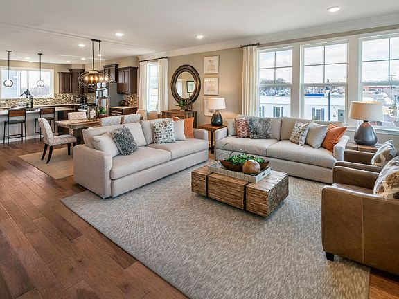 End home with lots of natural light and hardwood throughout the main living level