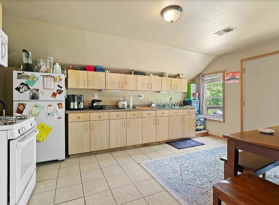 Kitchen has ample cabinets and storage, great eat in kitchen space