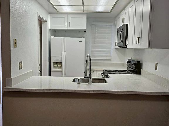 Newly renovated kitchen, new cabinets and countertops, new microwave