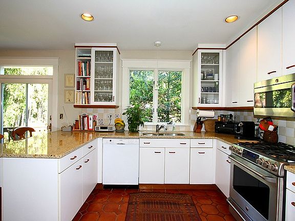 Kitchen opens to sunroom & deck