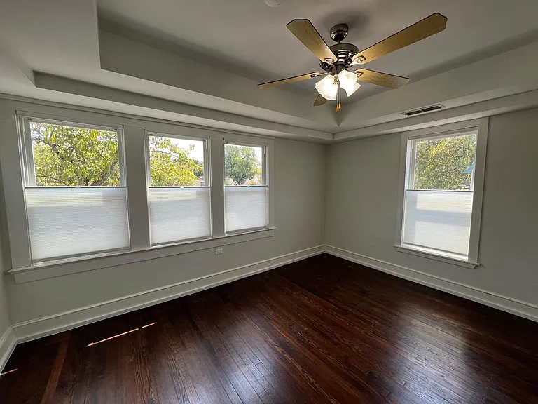 Master bedroom with new window top down/ bottom up cellular shades, all natural hardwoods, airy & spacious room with amazing tree top views.
