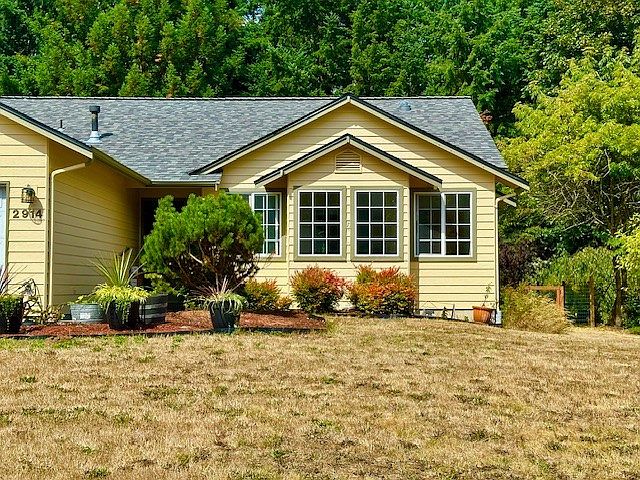 Home exterior. One story home. All 4 windows show are part of the 2 bedrooms for rent.