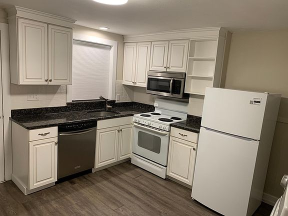 Kitchen: New microwave/range hood, new refrigerator (First floor)