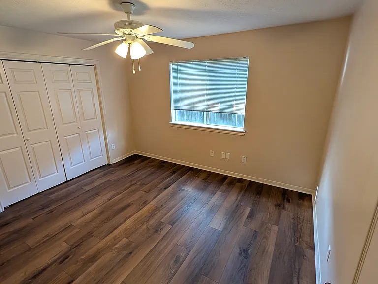 The North Bedroom measures 15x11' with a closet that is over 2' deep and 15' long.