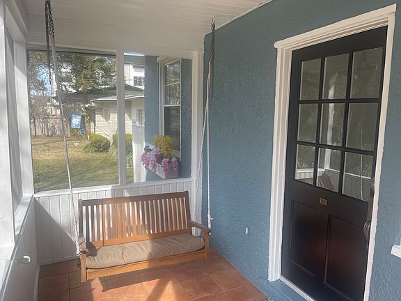 Screened front porch with porch swing included.
