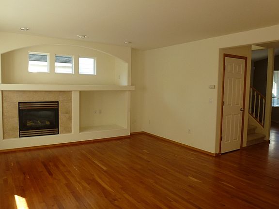 family room with gas fireplace, large area open to kitchen