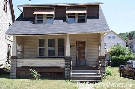 Front of house with large porch.
						:
						Porch is roomy and comfortable. Add your swing or chairs and meet the neighbors.