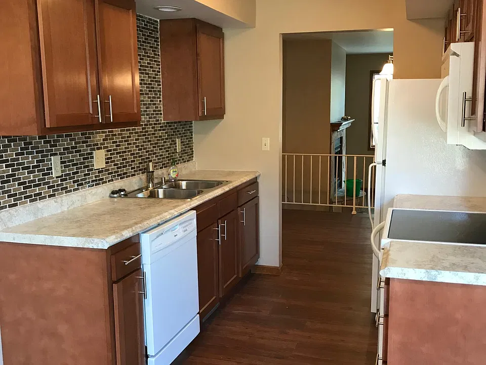 New kitchen cabinets, tiled backsplash, stainless steel appliances (not pictured)