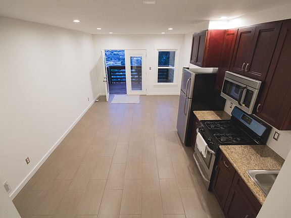 Open space floor plan - living room/kitchen. In door-outdoor living direct to patio.