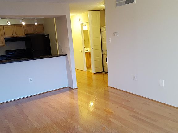 Living Rooming Facing Kitchen and Foyer