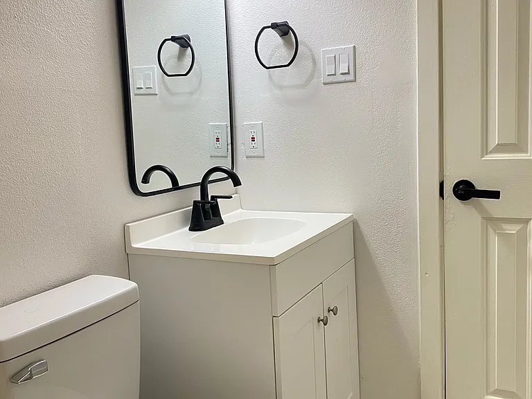Hallway bathroom with shower and tub