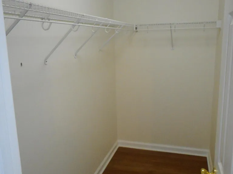 Master bedroom walk-in closet. Loads of storage room for sho