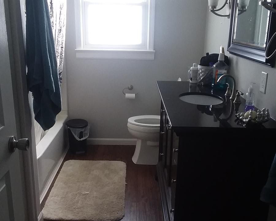 Bathroom with mirror and vanity plus large closet