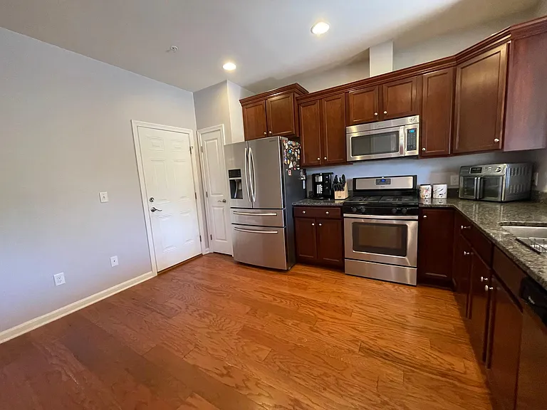 1st Floor Kitchen-Door leading into 2 car Garage