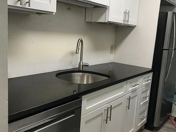 New kitchen with new stainless appliances.