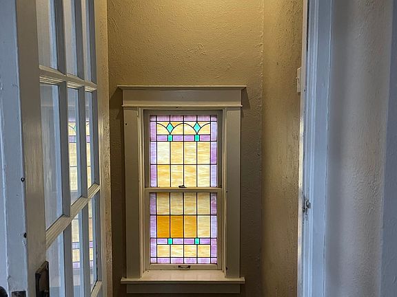 Entry stairway with beautiful stained glass