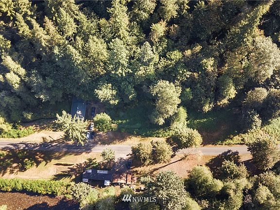 South Prairie Creek runs along the other side of the road from the home.  The raised roadway is the old railway bed.  Short walk down the street to the Fettig Road bridge crossing the creek.