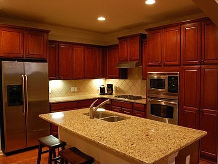 Every chef will love the large granite island, stainless built-in appliances, 