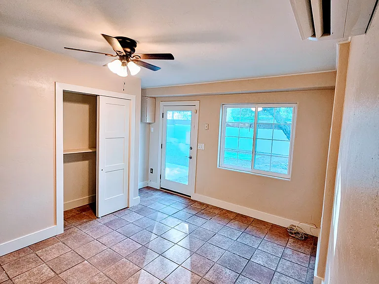 Large Living space or 3rd bedroom with door out to backyard