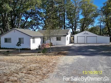 Front of House
						:
						Sits atop a hill, w/ four acres, and a two car garage with store room and office