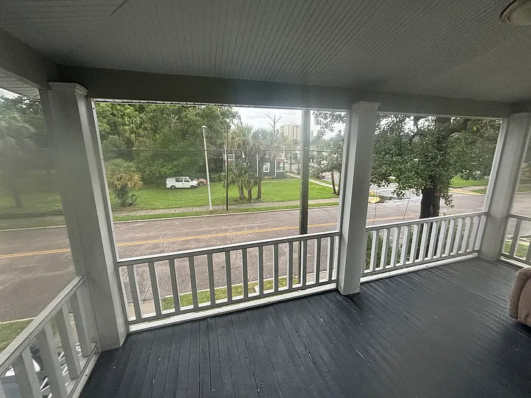 Upstairs front screened deck facing N Washington St.