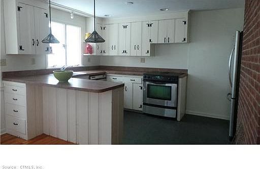 Kitchen w/ breakfast bar.