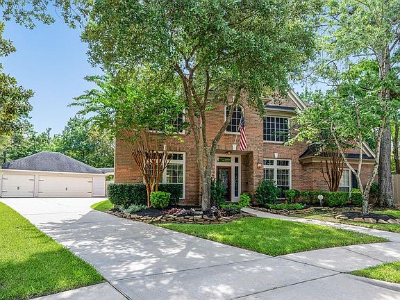 Mature trees and lush landscaping offers great curb appeal along with the detached 3-car extended garage with plenty of space for parking!