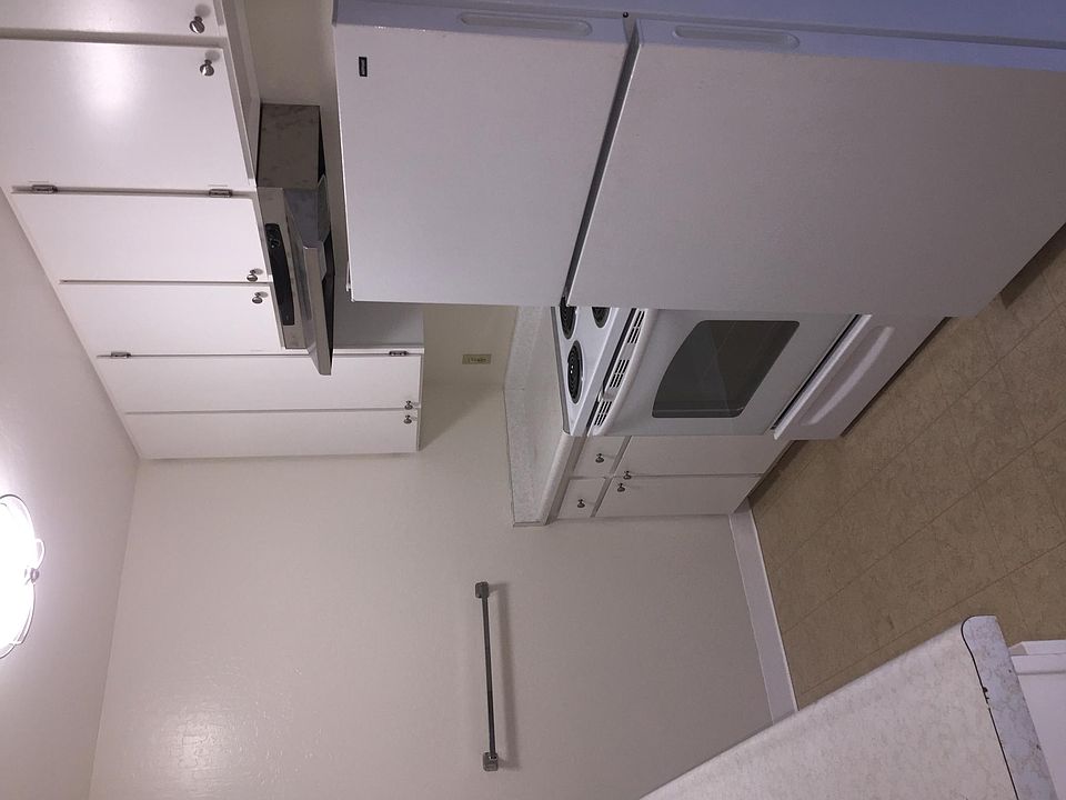 AEK kitchen has electric range, powerful cooking fan, refrigerator, brand new dishwasher, and disposal.