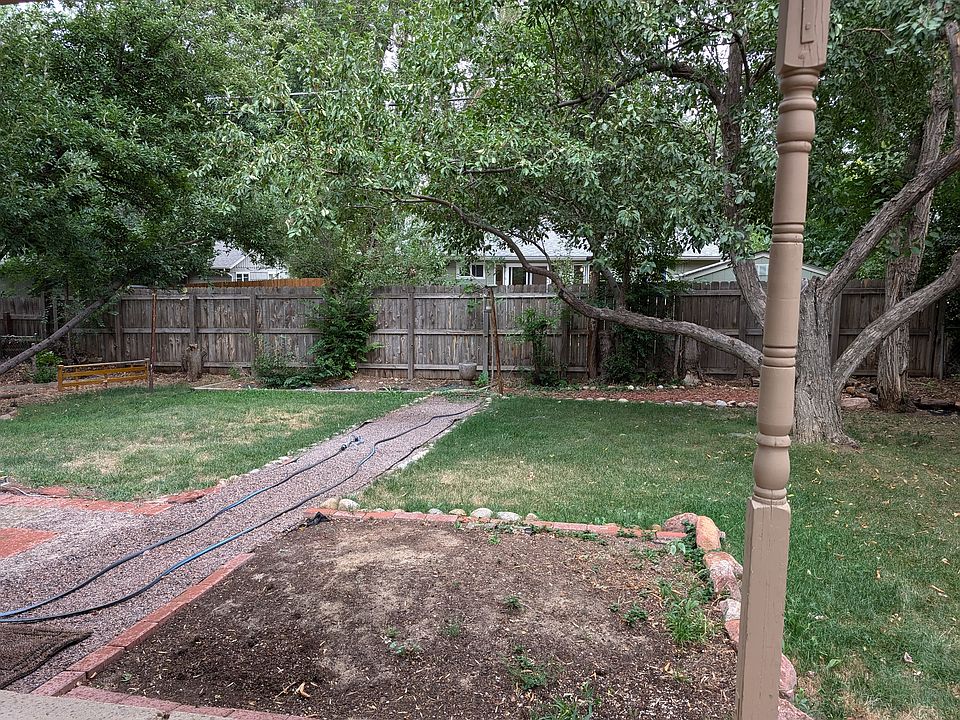 Fenced backyard with spot for garden