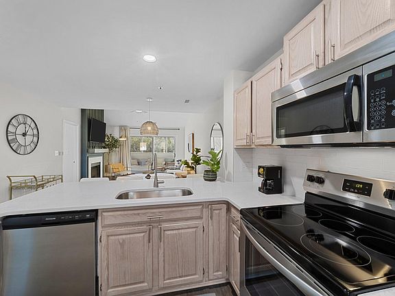 View from kitchen to living area and screened porch.