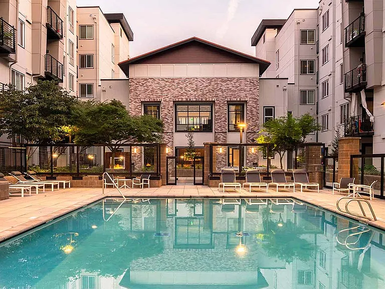Apartment community resort style pool + cabanas at Griffis Lake Washington in Renton, Washington.