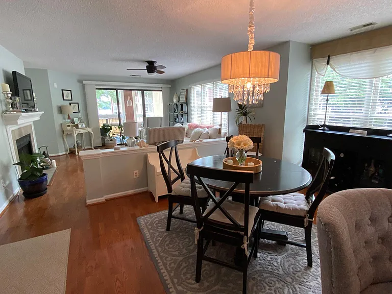 dining area / living area / sliding doors to deck overlooking lake