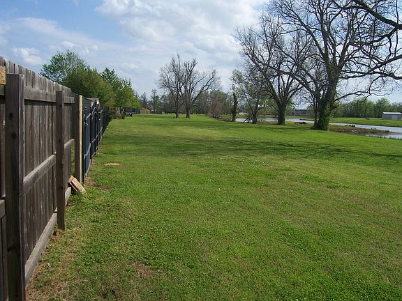 Open land and bayou south

