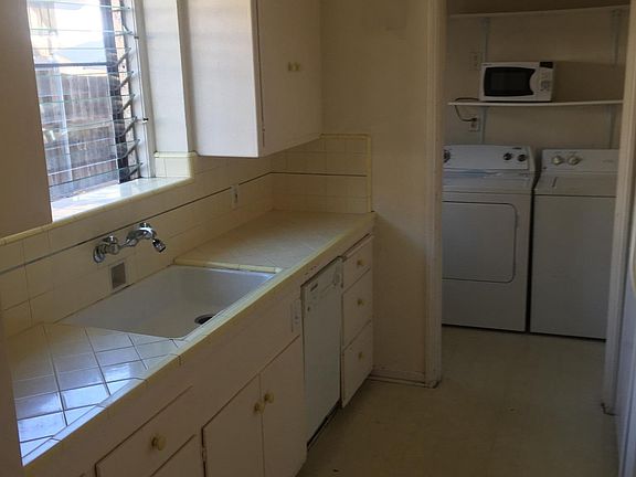 Kitchen & service porch (washer & dryer not included)